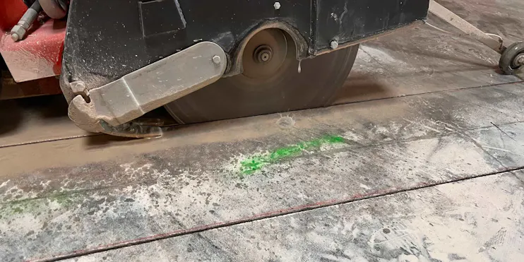 Concrete saw cutting in progress